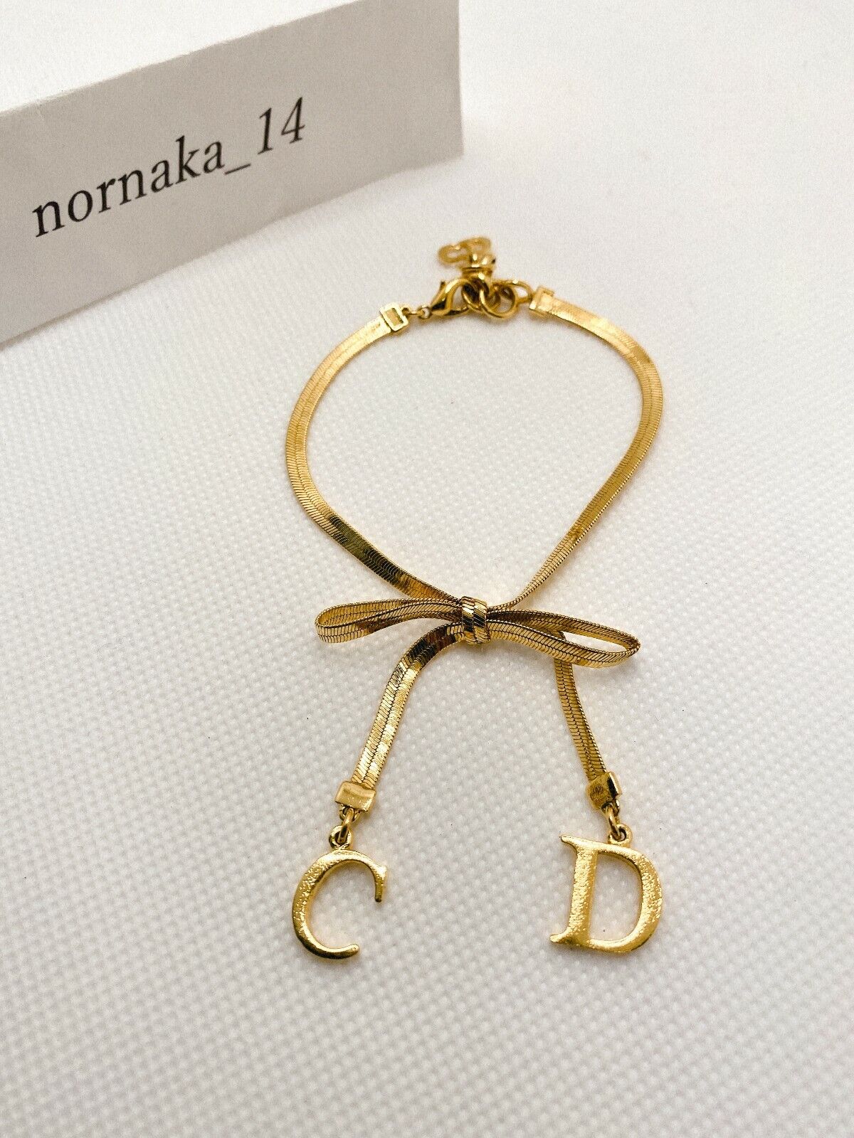 Near MINT Christian Dior CD Logo Ribbon Motif Bracelet Gold Near MINT Christian Dior CD Logo Ribbon Motif Bracelet Gold