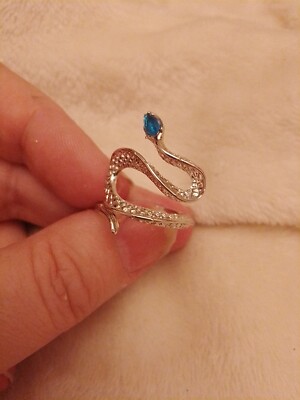Beautiful Silver Coloured Metal Winding Snake Adjustable With Pear Cut Blue Gem