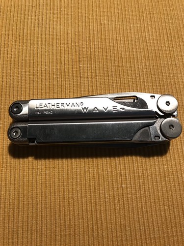 New, Pre-Owned, Retired Original 1999 Leatherman Wave with Leather Sheath