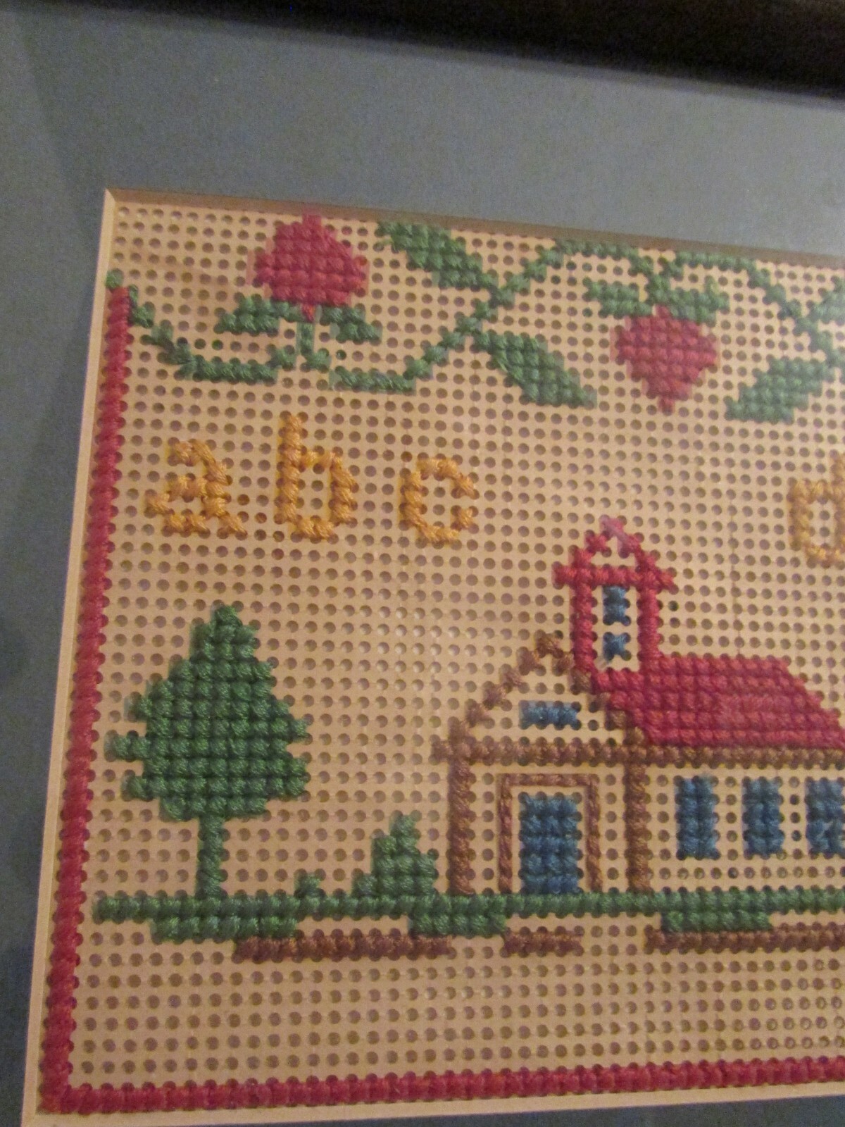 VINTAGE SCHOOL HOUSE MATTED SAMPLER PUNCH PAPER PICTURE IN CROSS FRAME