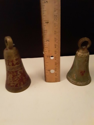 Five ornate engraved brass bells colored