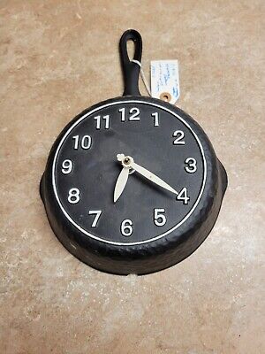 Cast Iron ,skillet clock. cast iron moulded as clock, 1950's clock works.