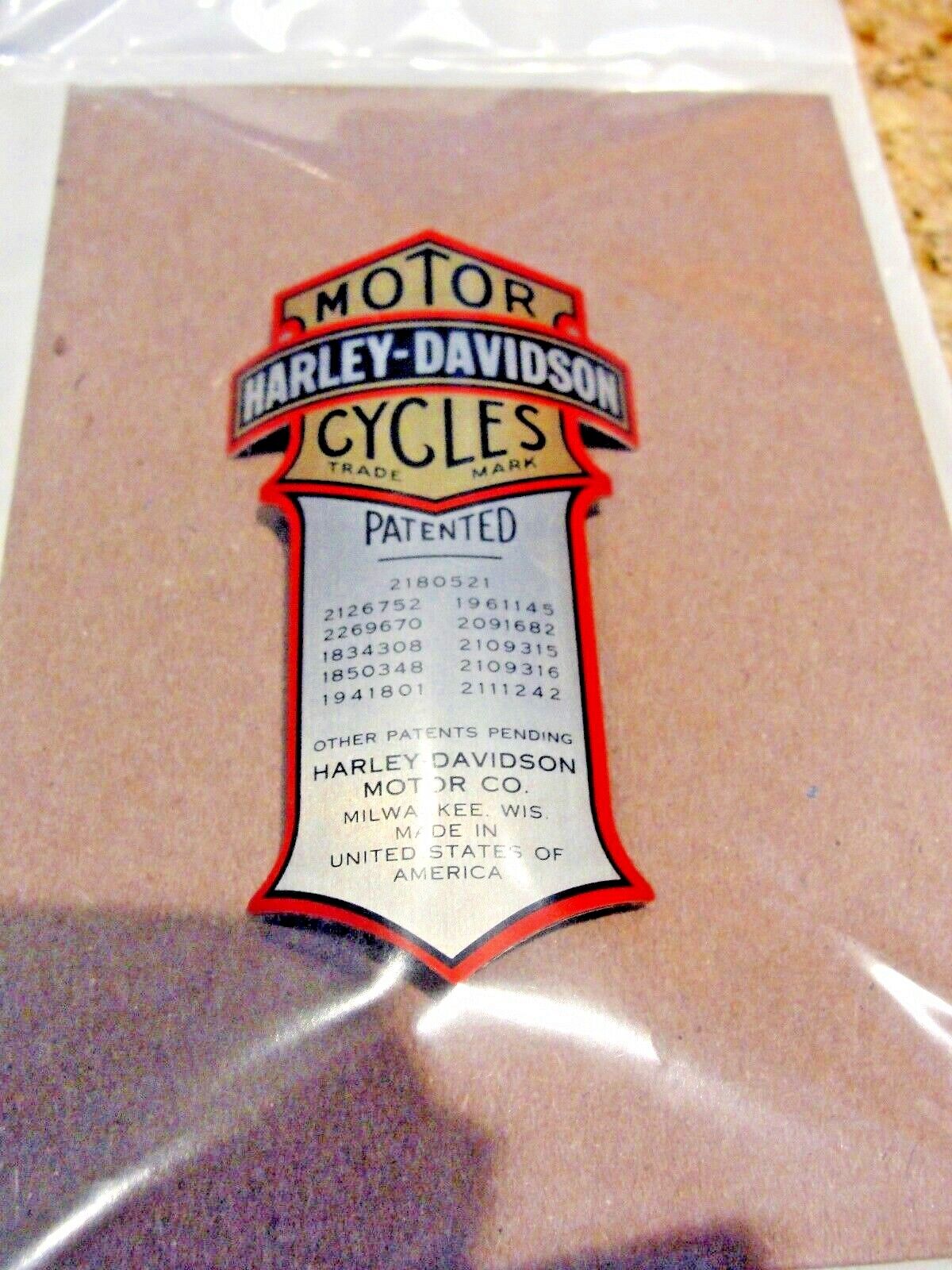 Harley Patented Shock Nameplate Curved Metal OEM Emblem Harley Patented Shock Nameplate Curved Metal OEM Emblem