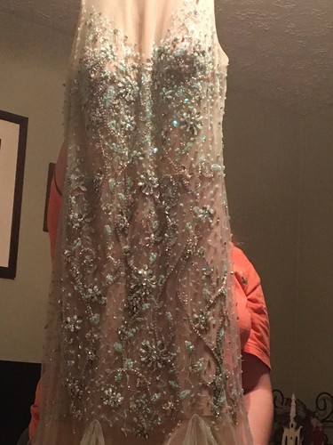 Aqua/teal prom dress size 6. It’s embellished with sequins in various places.