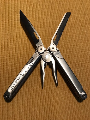 New, Pre-Owned, Retired Original 1999 Leatherman Wave with Leather Sheath