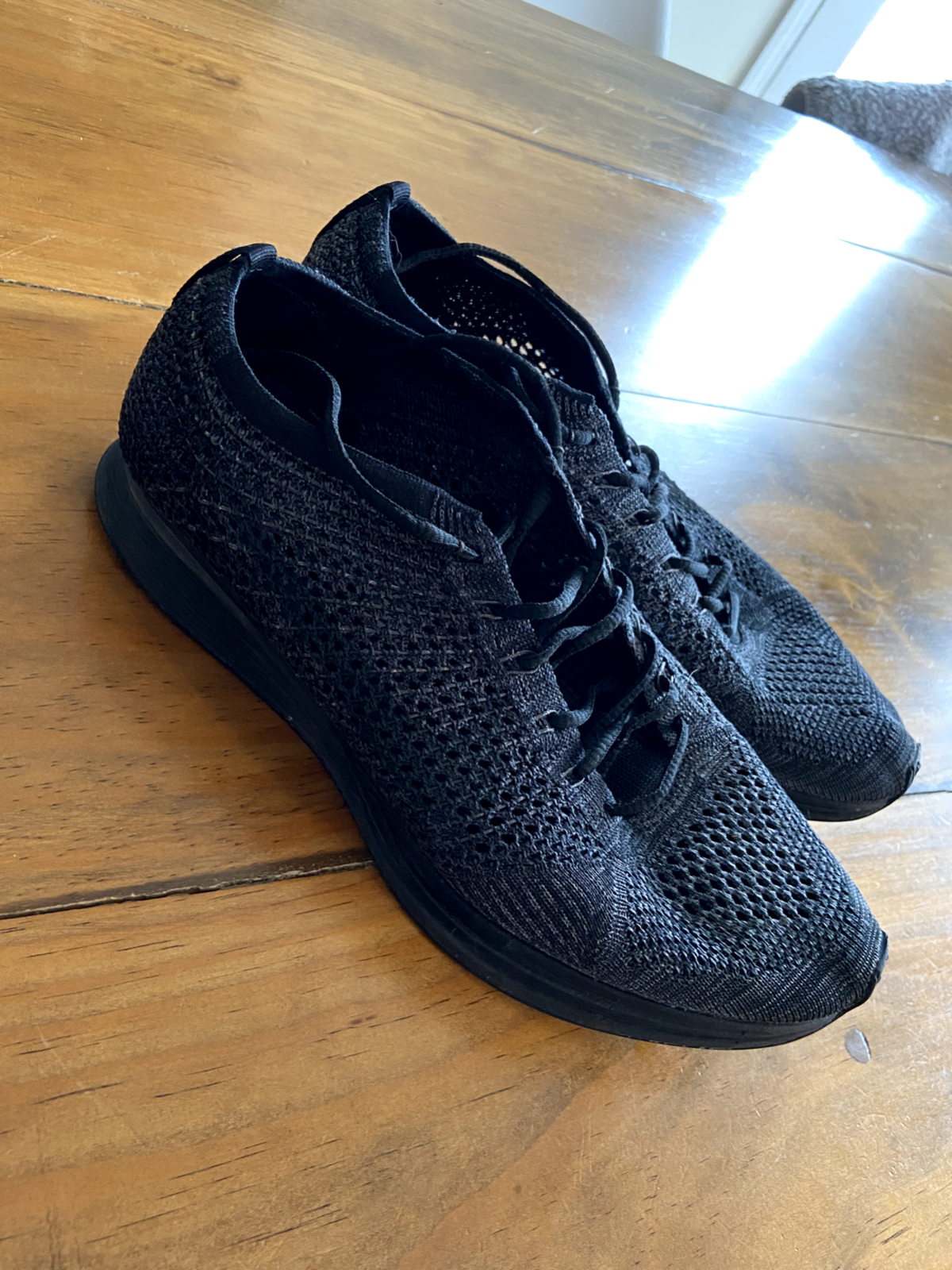 nike flyknit racer triple black