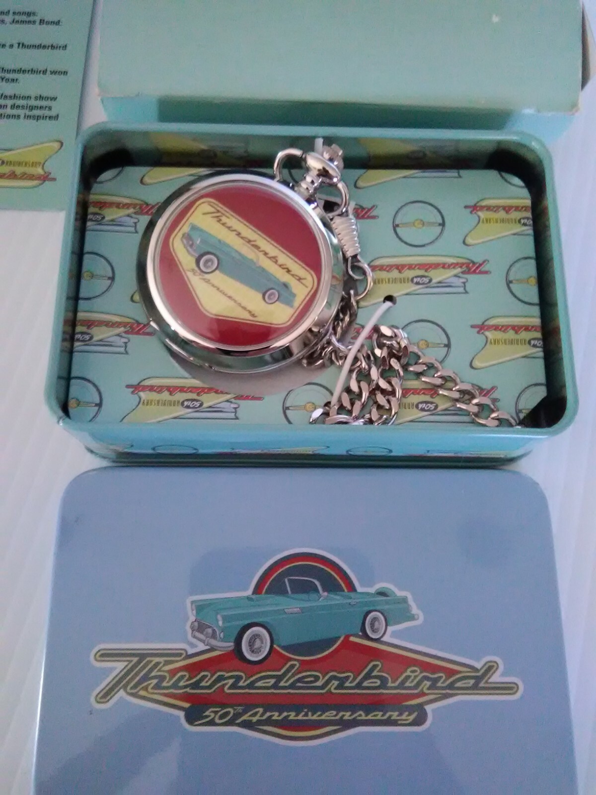 Ford Thunderbird collectible pocket watch and tin.