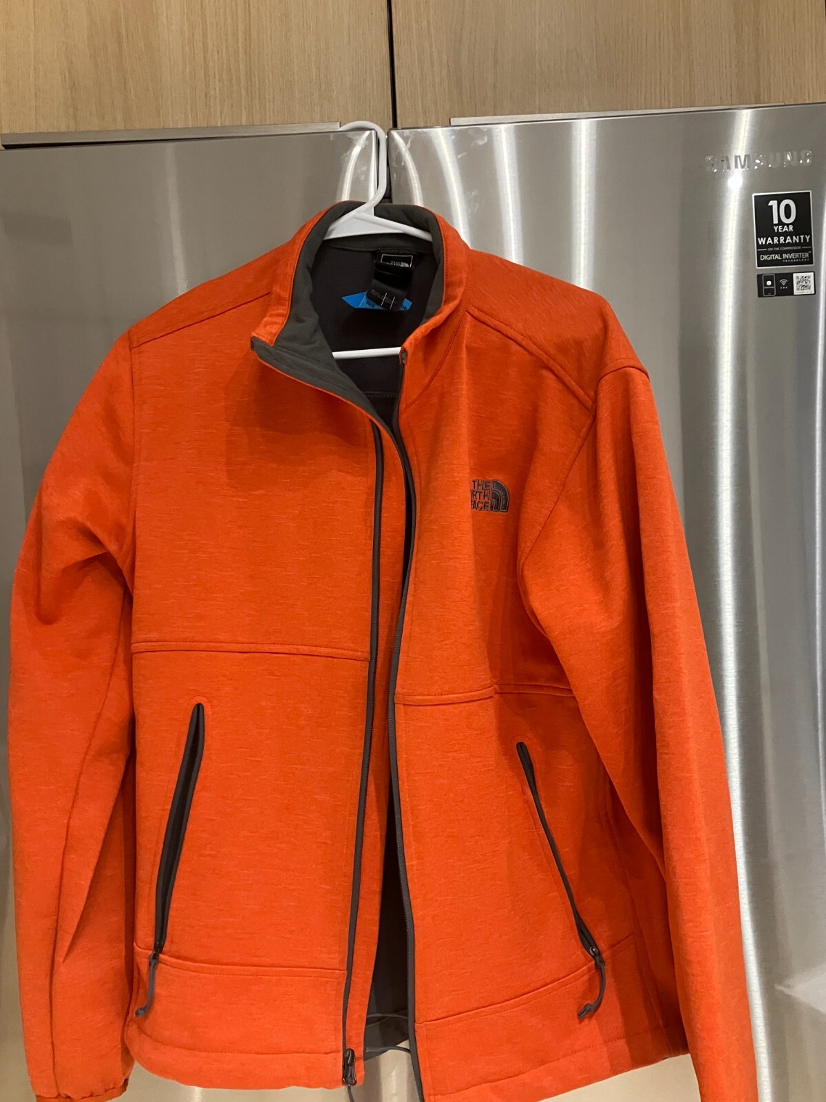 The  North Face Orange full  zip up  jacket men's adult Medium