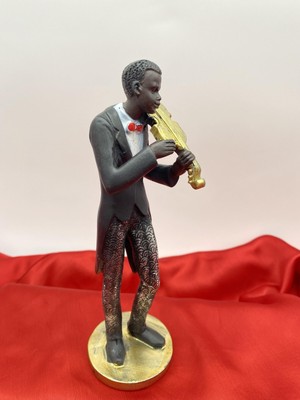 Beautiful sculpture of violin Player .