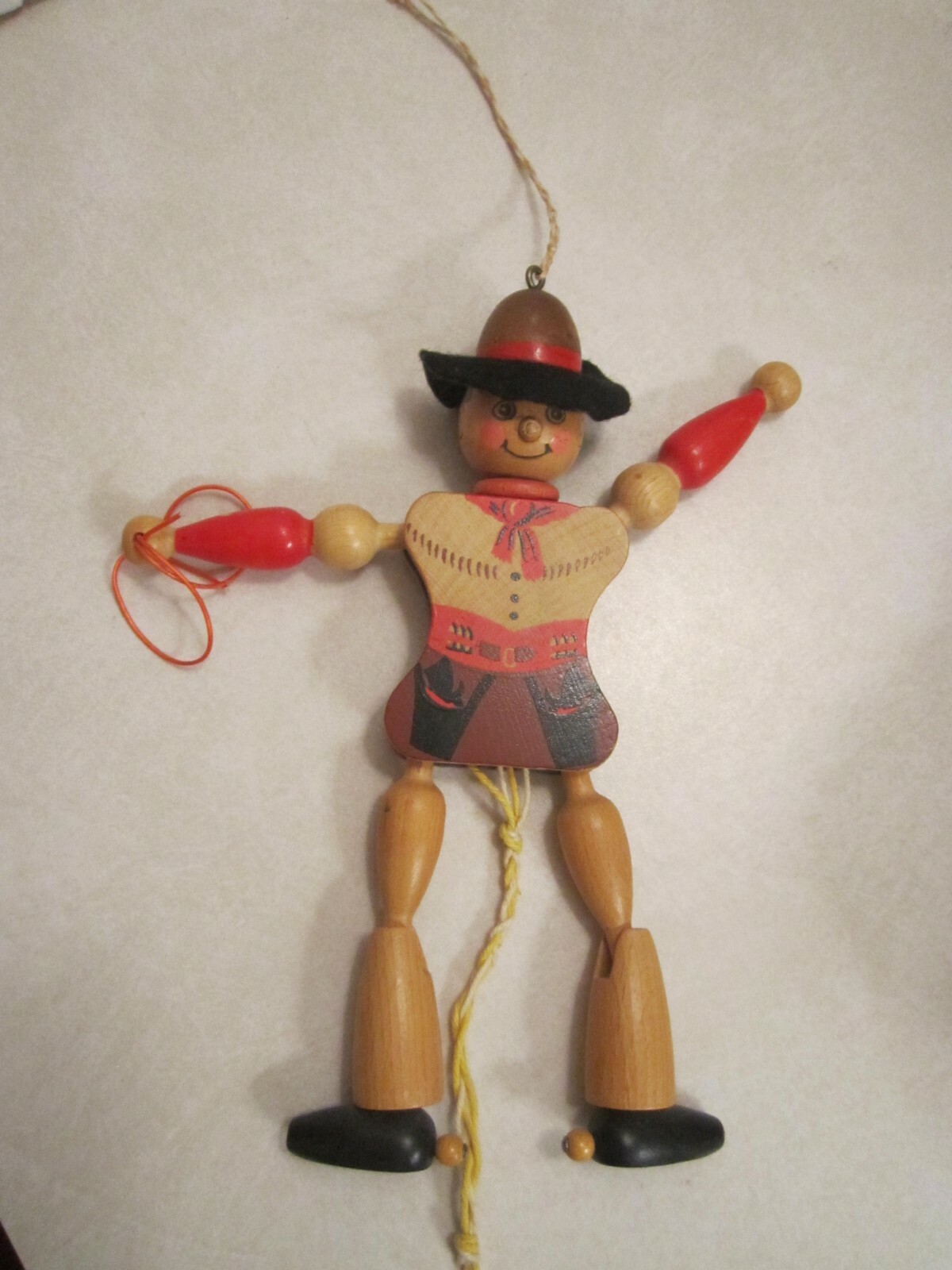 vintage wooden cowboy jumping-jack (marionette) puppet