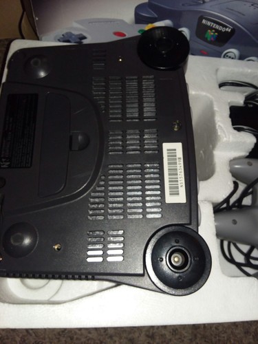 Nintendo 64 Console In Box with 2, oringal Controllers, and 3 games..