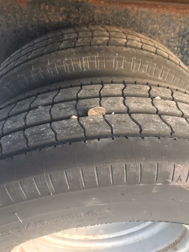 2008 Big Tex Black 3 Car Hauler Tandem Used Trailer with dual rear wheels.