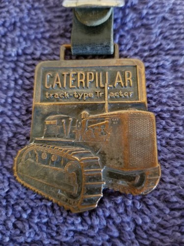 VINTAGE CATERPILLAR TRACK TYPE TRACTOR, WATCH FOB