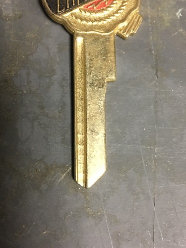 Vintage Designer Chrysler Key Blank And Key Chain Multi Colored W Chrysler Logo