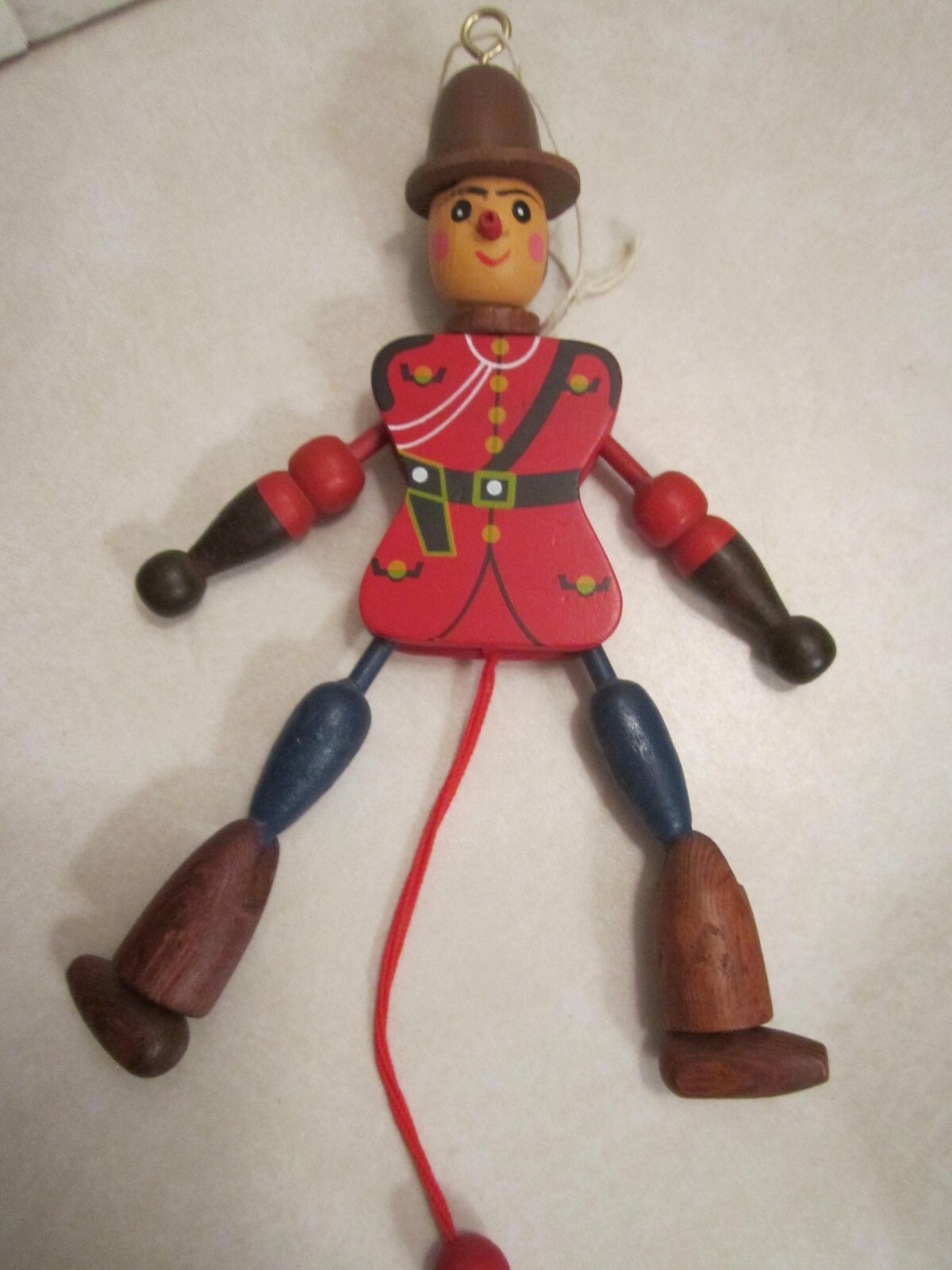 vintage wooden Canadian Mounty jumping-jack (marionette) string puppet