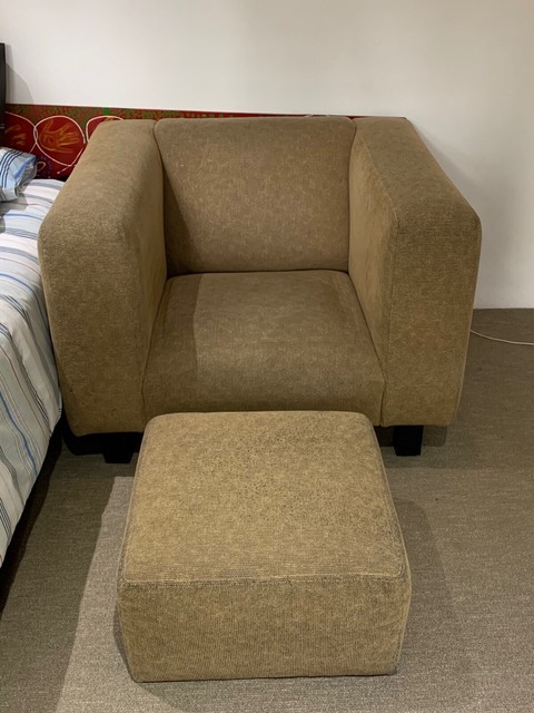 tan armchair with ottoman