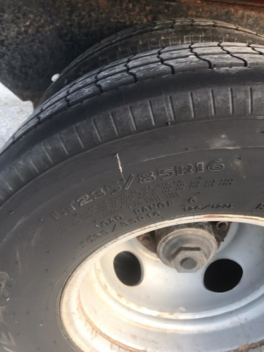 2008 Big Tex Black 3 Car Hauler Tandem Used Trailer with dual rear wheels.