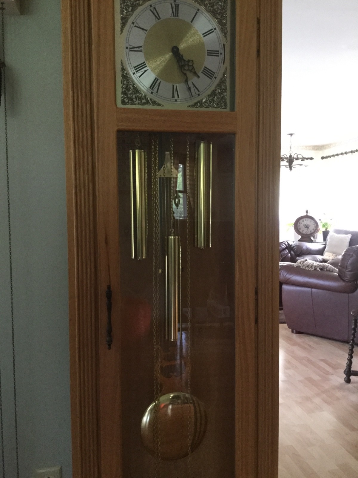 Grandfather  clock. Howard Miller. Light oak.
