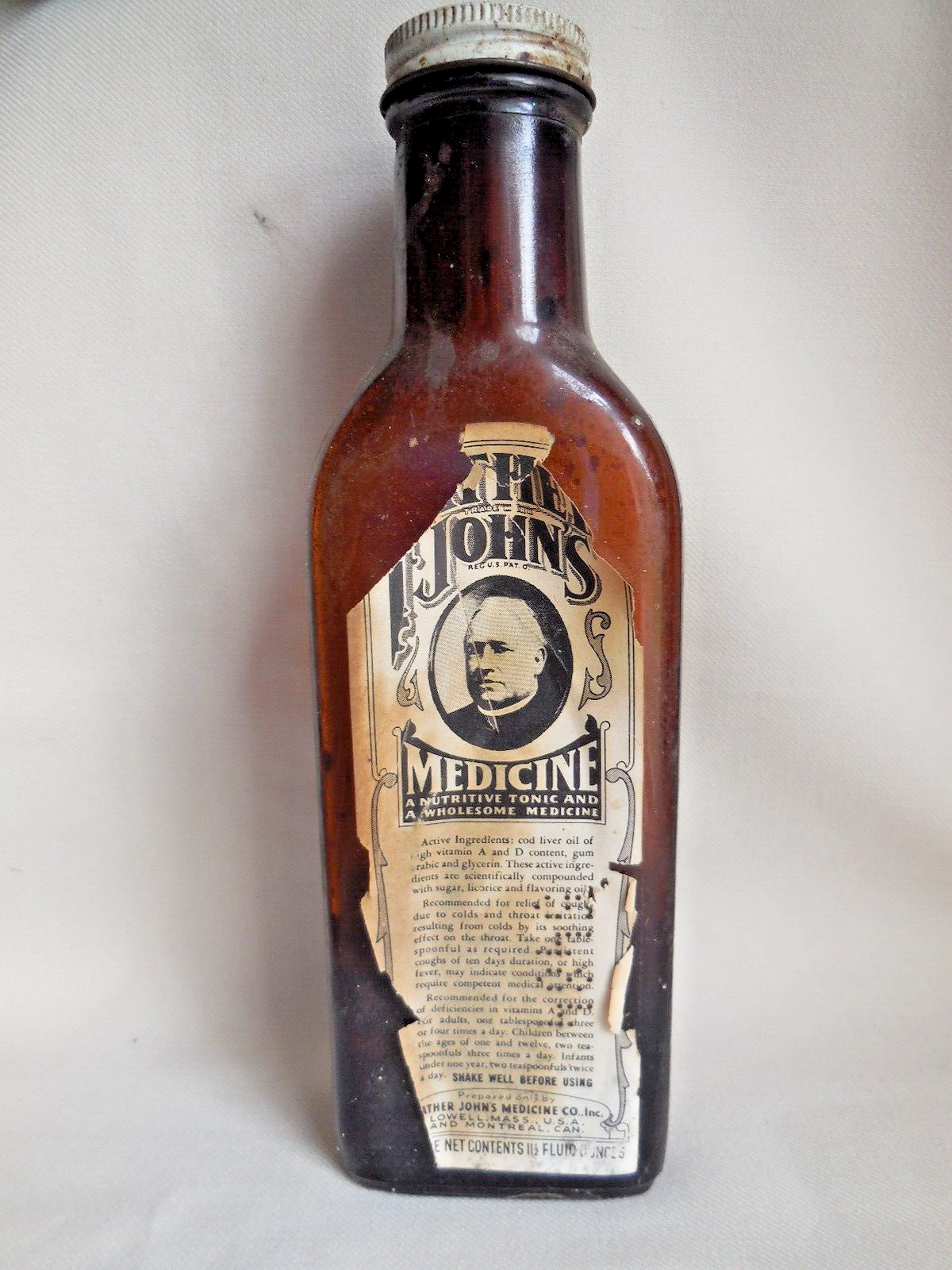 ANTIQUE FATHER JOHN'S MEDICINE EMBOSSED & LABELED BROWN BOTTLE