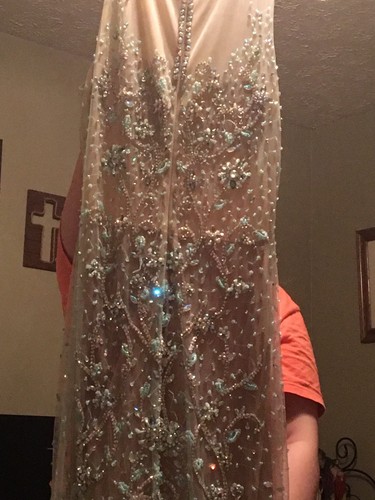 Aqua/teal prom dress size 6. It’s embellished with sequins in various places.