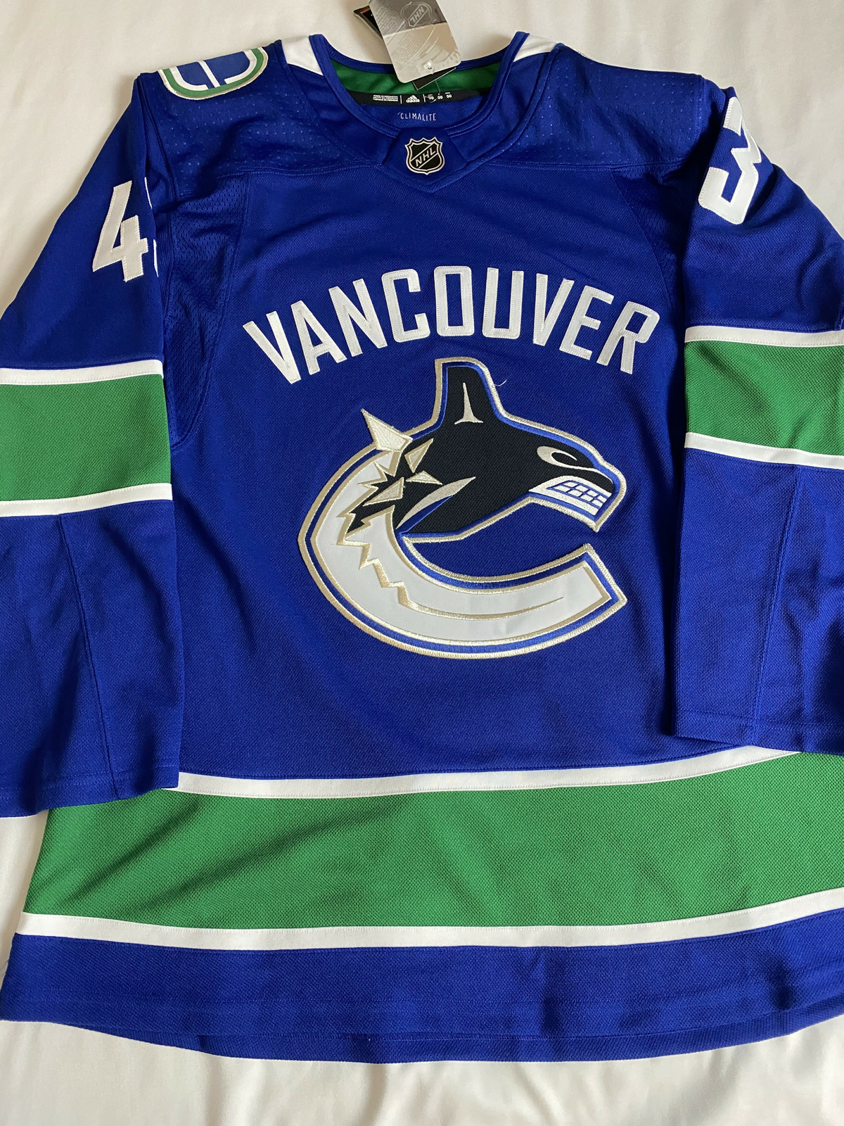 quinn hughes signed jersey