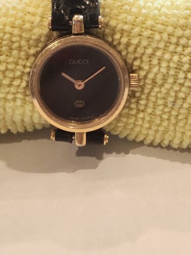 Vintage 1980s GUCCI Gold-Tone/Black GG Watch with Striped Vintage 1980s GUCCI Gold-Tone/Black GG Watch with Striped