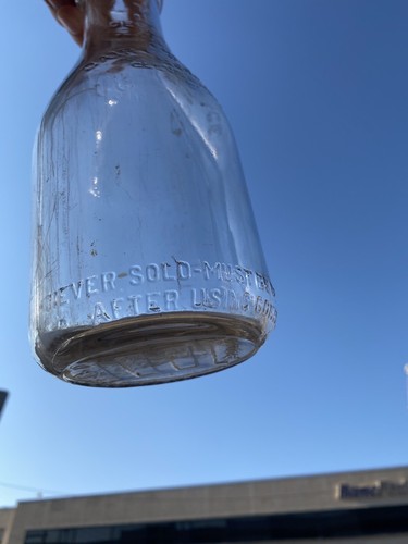 The Dairy Package Corp, Cleveland Ohio, Embossed One Quart Milk Bottle