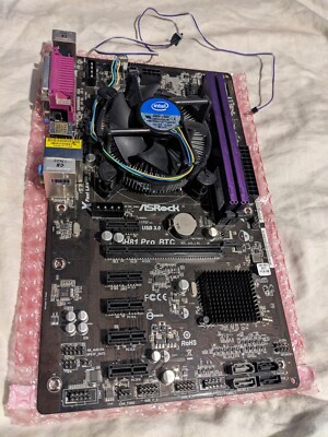 ASRock H81 Pro BTC R2.0 Mining Motherboard LGA 1150 with CPU, RAM, Power Switch.