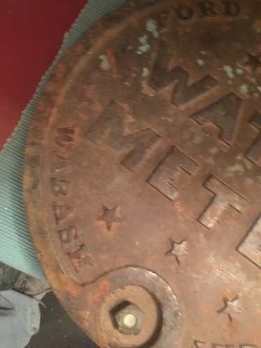Vintage castiron ford water meter lid