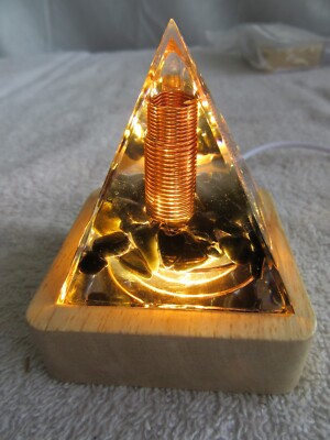 Orgone Pyramid Copper coil black base copper coil with lighted wood base.