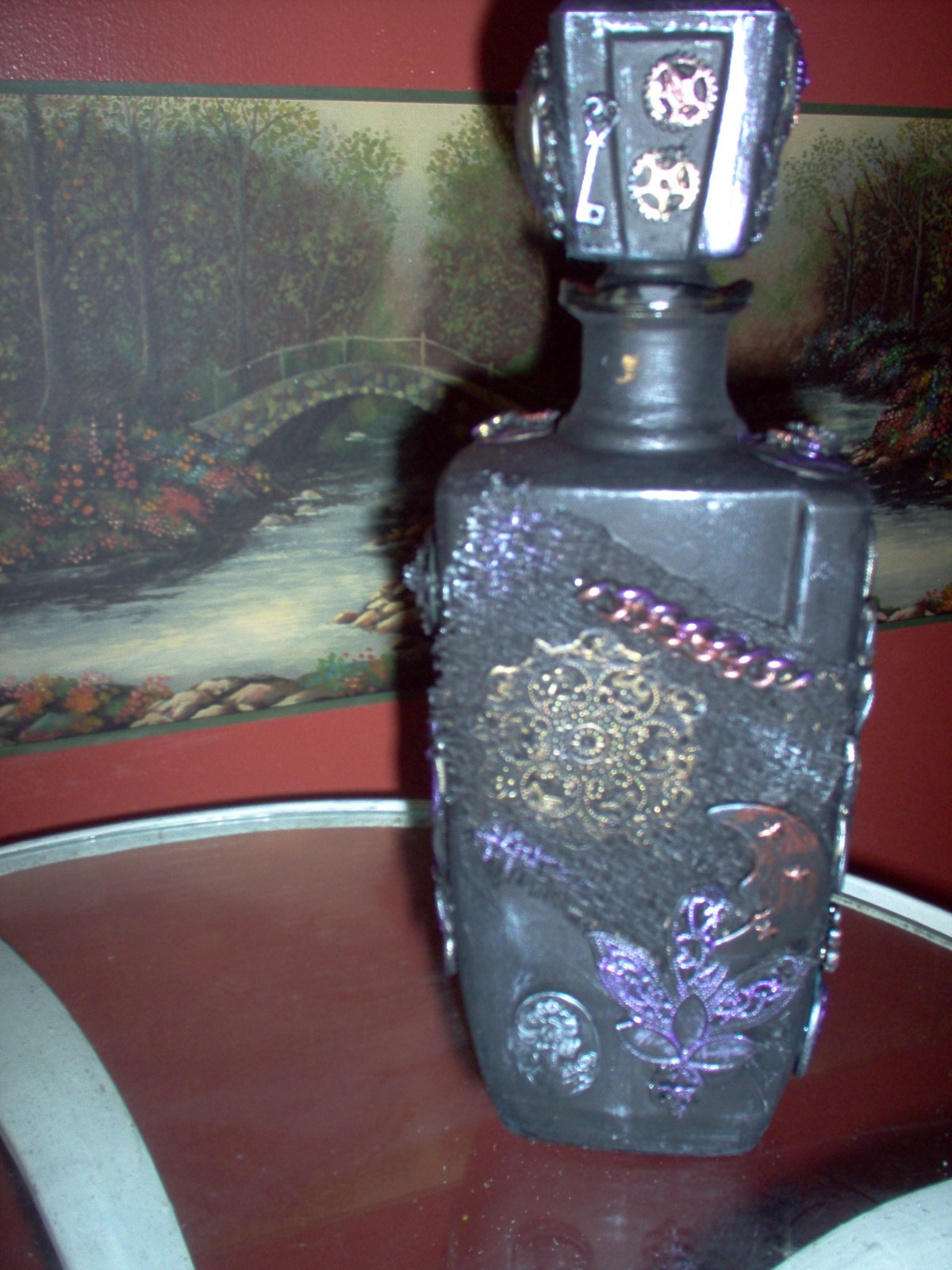 steampunk/altered art decanter, black, metallic highlights. 11