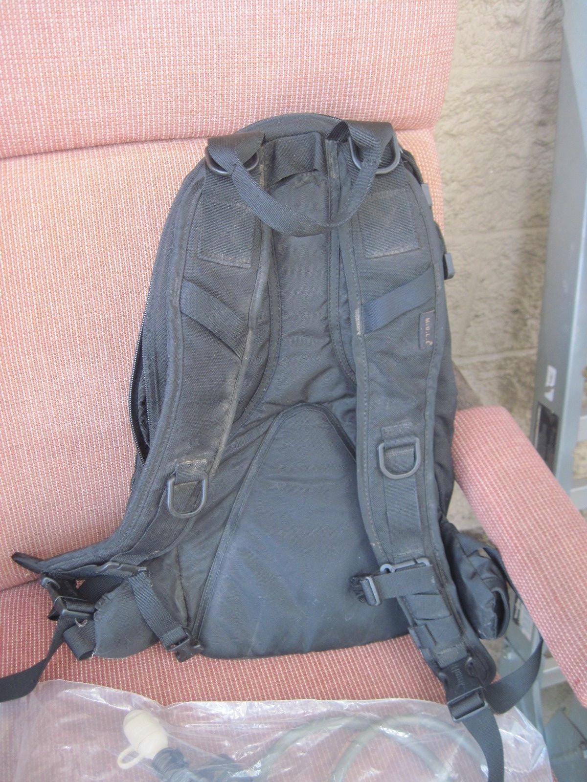 CAMELBAK WITH POCKETS AND NEW BLADDER   BLACK IN  COLOR