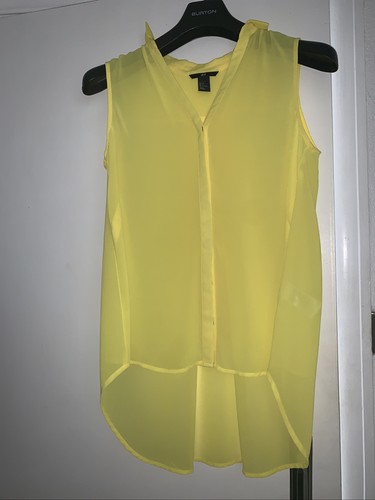 yellow sleeveless blouse