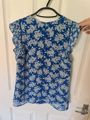Blue and white floral blouse with ruffle cap sleeve embroidered centre Size 8