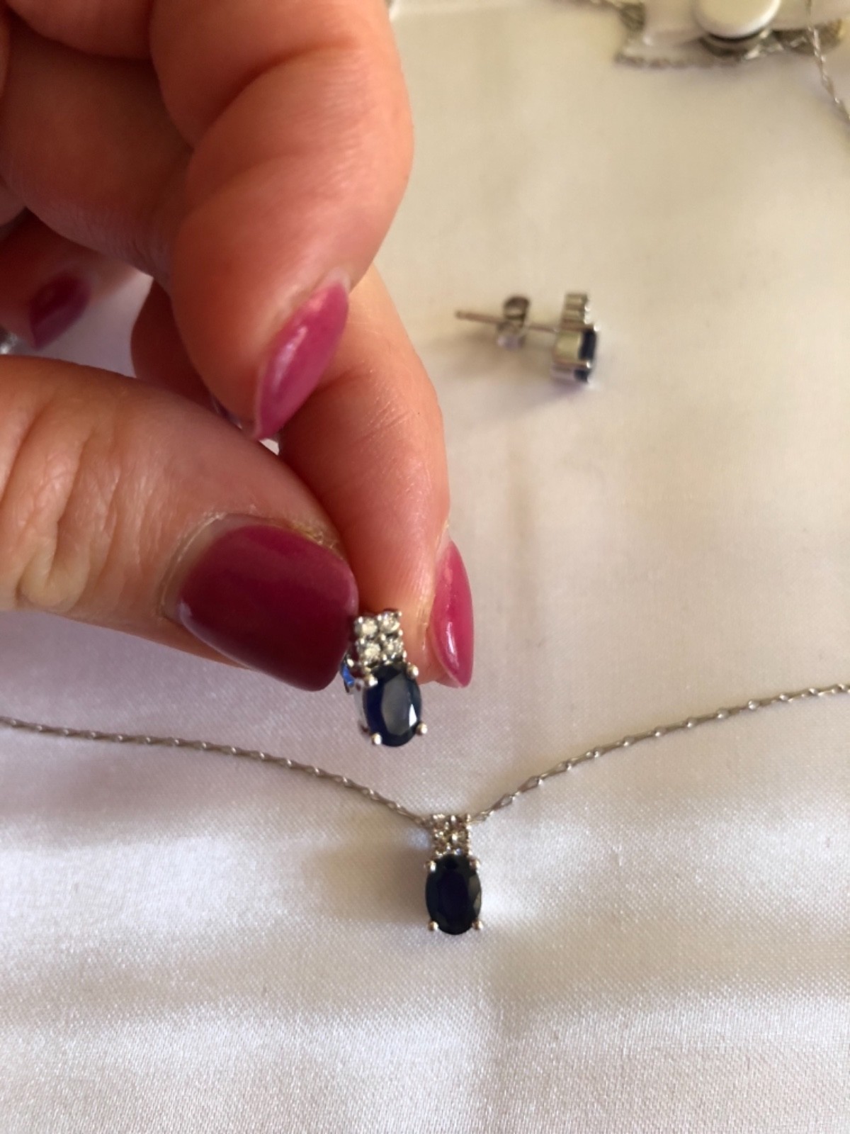 New 14 karat white gold sapphire/diamond pendant earring set