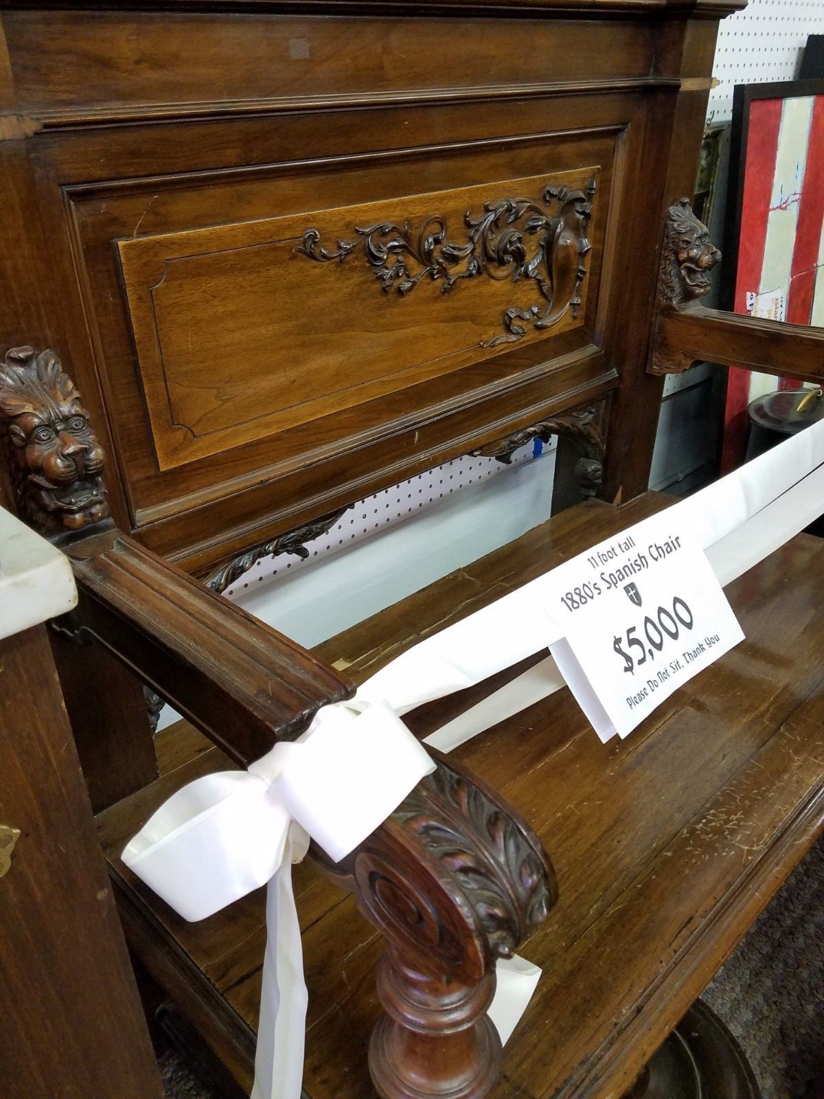 11' tall Griffin chairs heavily carved.