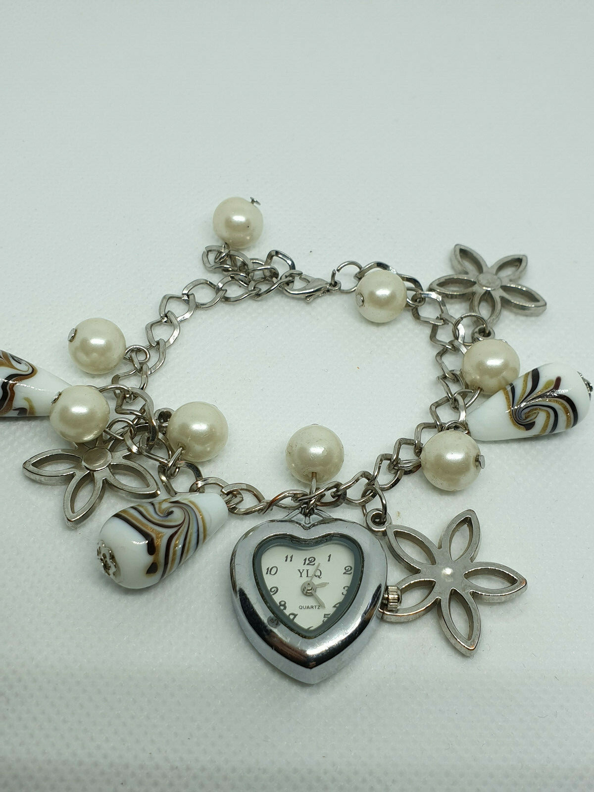 ladies ylq silver tone bracelet watch with a heart shape