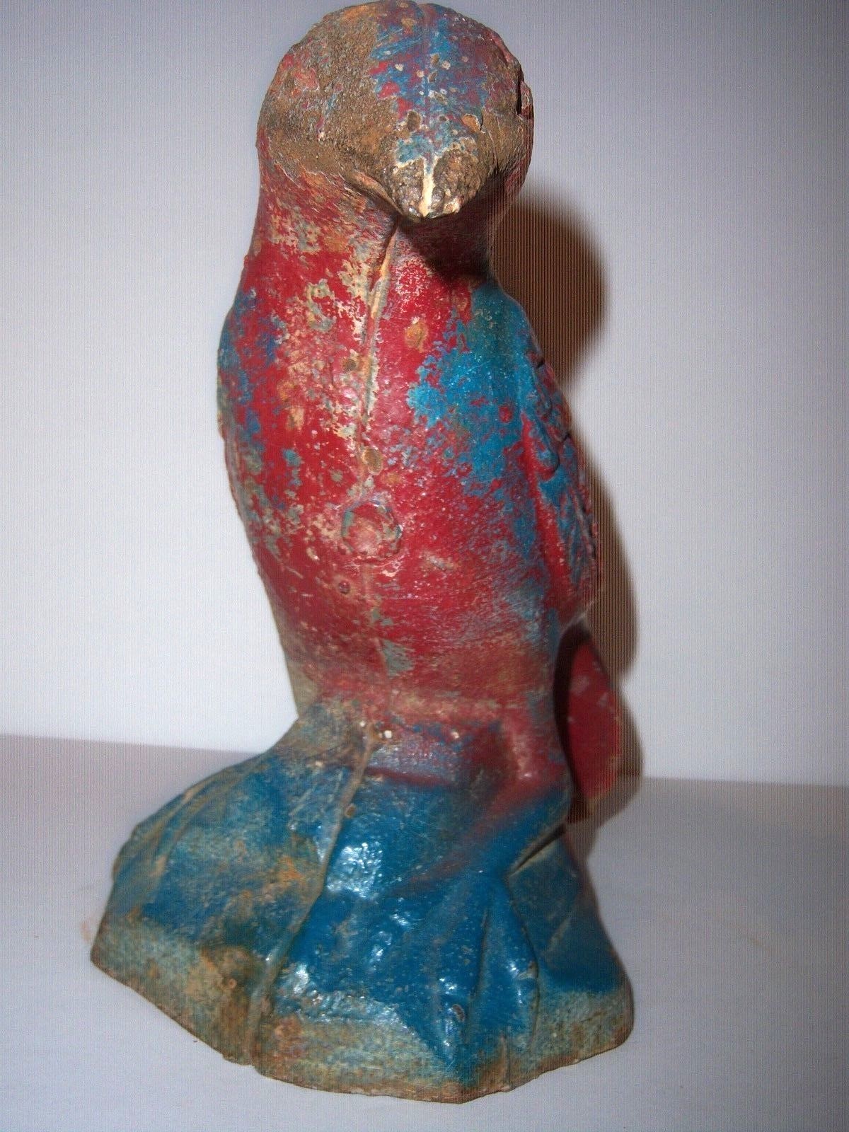 ...ANTIQUE CAST IRON BIRD DOORSTOP