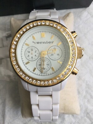 LADIES VERNIER WATCH GOLD TONE RHINESTONE DETAIL CHRONOGRAPH WHITE BAND WATCH