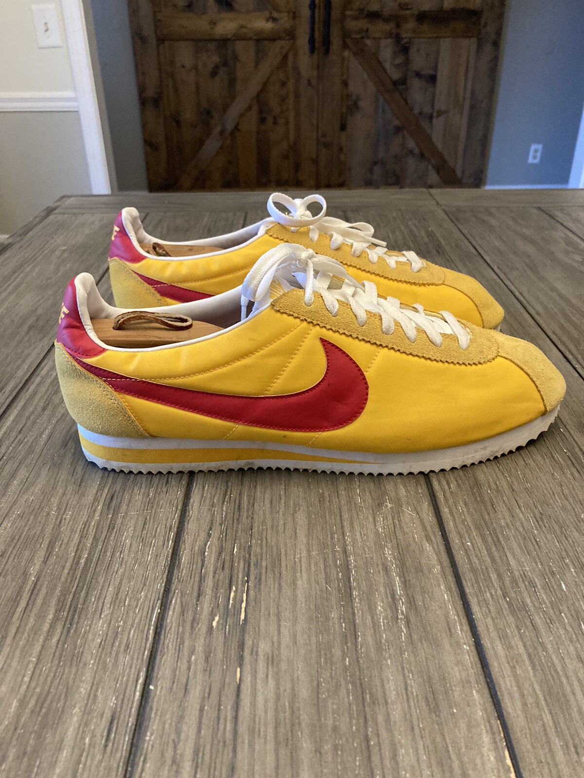 Nike cortez yellow clearance red