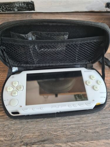 White Sony psp console with games