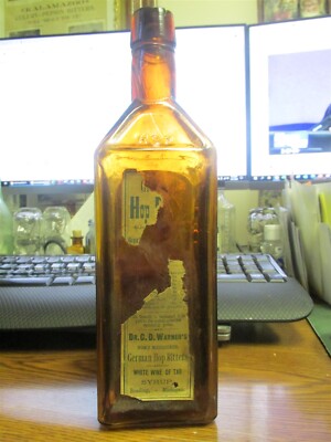 Reading, Mich. Dr. Warner's German Hop Bitters 1880 semi-cabin bottle w/ labels