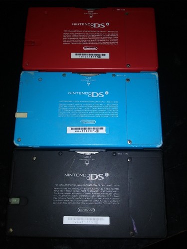 Nintendo Red DSI with 1 game,charger, and stylus