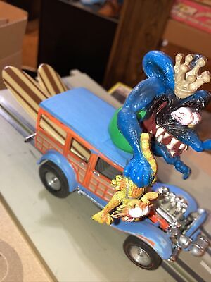 1/32 Slot Car Ford Woodie With Rat Fink by Big Daddy Roth.  Runs Good  