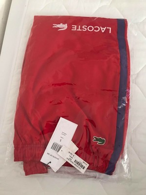 red lacoste track pants