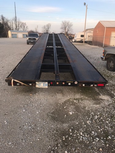 2008 Big Tex Black 3 Car Hauler Tandem Used Trailer with dual rear wheels.