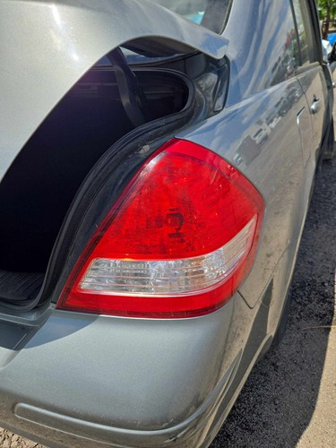 Used Right Tail Light Assembly fits: 2009 Nissan Versa quarter panel mounted Sdn