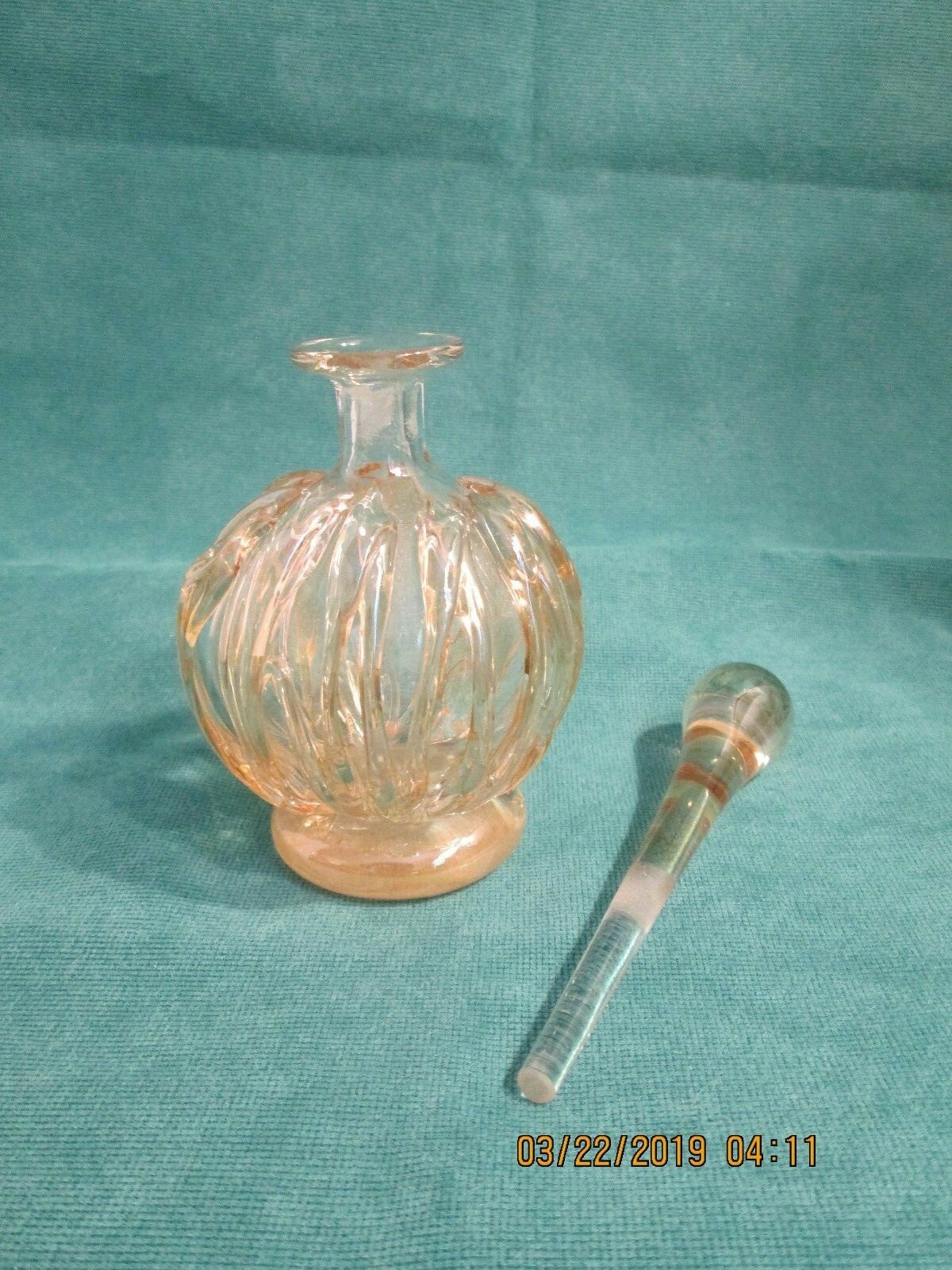VTG. PERFUME BOTTLE. CASCADING GLASS OVER GLASS. LONG STOPPER. PALE GOLD COLOR