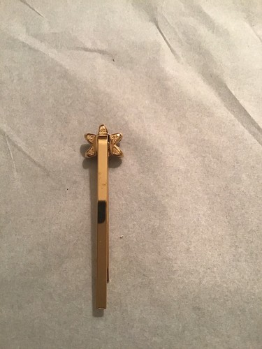ST JOHN KNIT FLOWER GOLD TONE HAIR CLIP. AMBER COLORED ENAMEL SWAROVSKI ACCENTS
