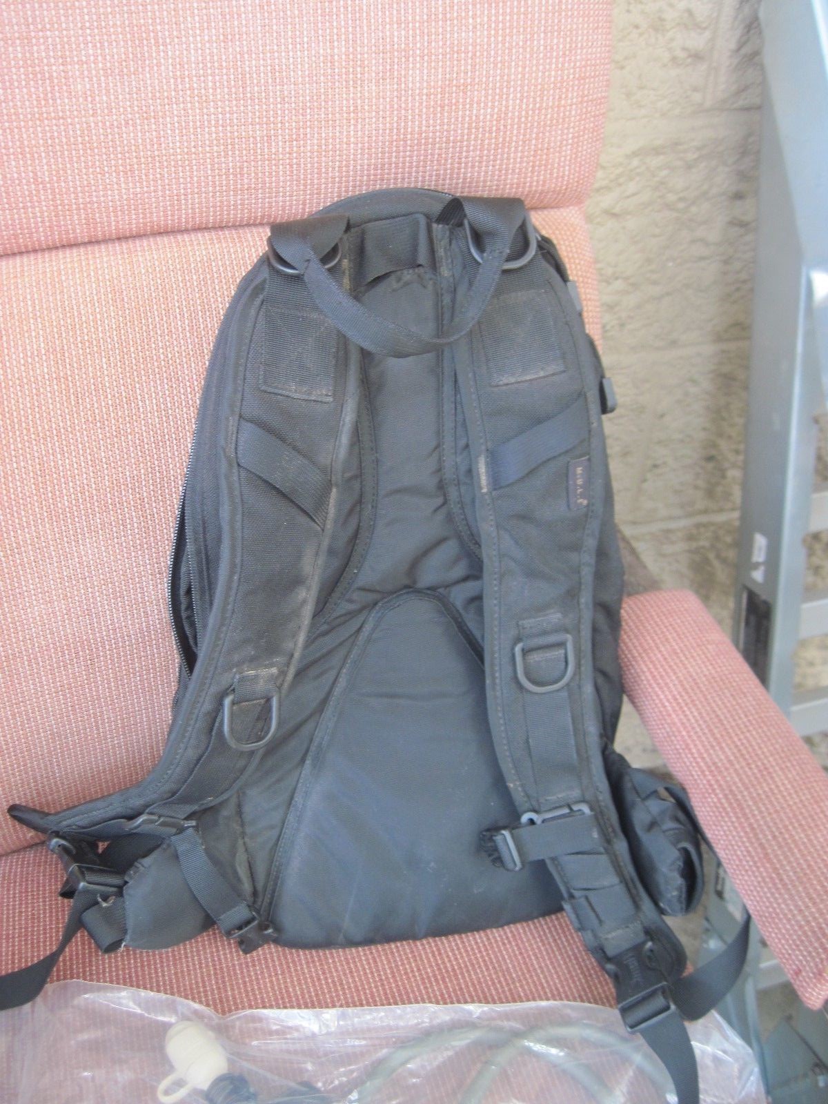CAMELBAK WITH POCKETS AND NEW BLADDER   BLACK IN  COLOR
